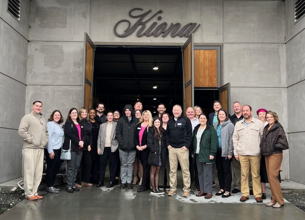 Class 27 group photo in front of Kiona Winery 